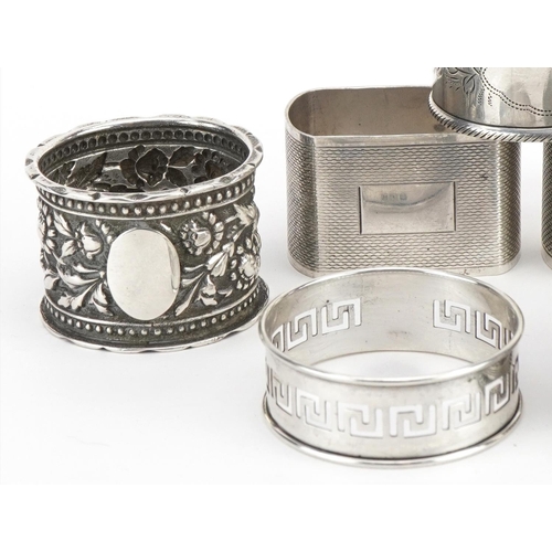 201 - Seven Victorian and later silver napkin rings, various hallmarks, the largest 4.8cm wide, total 162.... 