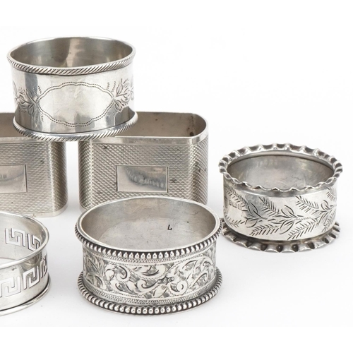 201 - Seven Victorian and later silver napkin rings, various hallmarks, the largest 4.8cm wide, total 162.... 