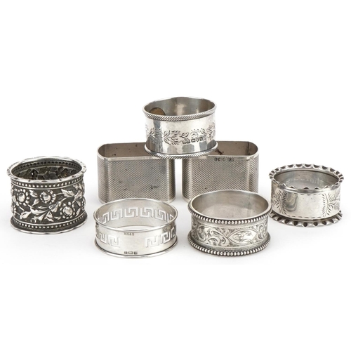 201 - Seven Victorian and later silver napkin rings, various hallmarks, the largest 4.8cm wide, total 162.... 