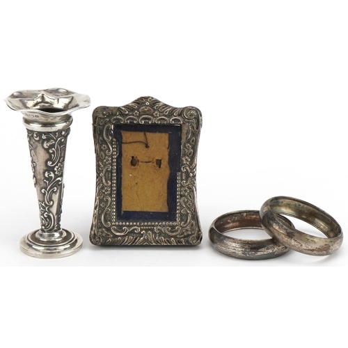 1611 - Edwardian and later silver objects comprising miniature bud vase, easel photo frame and pair of napk... 