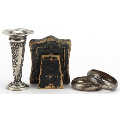 1611 - Edwardian and later silver objects comprising miniature bud vase, easel photo frame and pair of napk... 