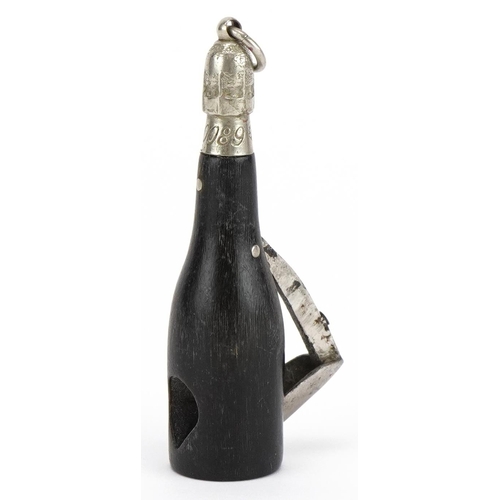 1490 - Victorian horn cigar cutter in the form of a Champagne bottle, impressed lozenge mark and numbered 4... 