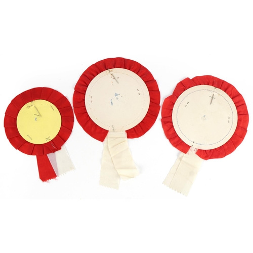 1285 - Three footballing interest Manchester United rosettes including FA Cup final at Wembley