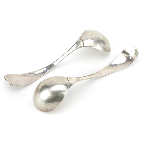 125 - Pair of Continental Arts & Crafts beaten silver ladles impressed Z to the handle, 17cm in length, 76... 