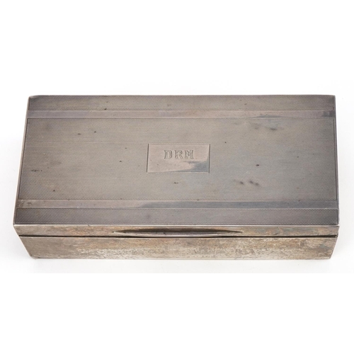 244 - Padgett & Braham Ltd, Art Deco silver cigar box, the hinged lid with engine turned decoration, Londo... 