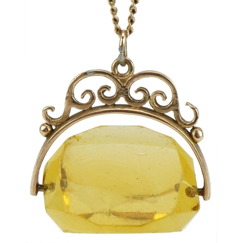 2069 - Unmarked gold citrine spinner fob on a 9ct gold necklace, 2.5cm high, 42cm in length, total weight 8... 