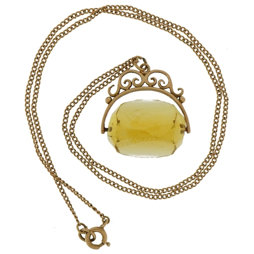 2069 - Unmarked gold citrine spinner fob on a 9ct gold necklace, 2.5cm high, 42cm in length, total weight 8... 