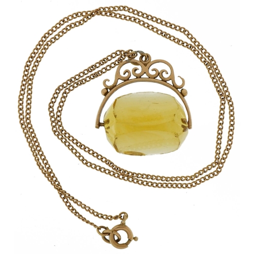 2069 - Unmarked gold citrine spinner fob on a 9ct gold necklace, 2.5cm high, 42cm in length, total weight 8... 