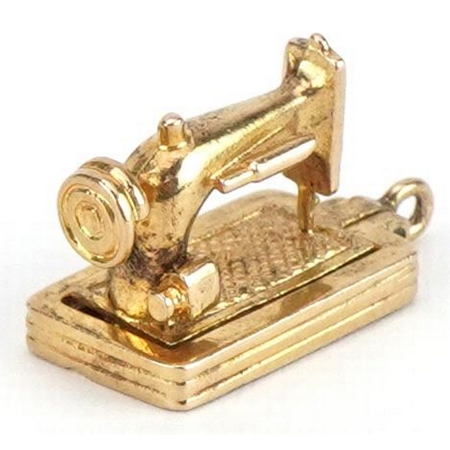 2104 - 9ct gold opening sewing machine charm, 1.9cm in length, 3.8g