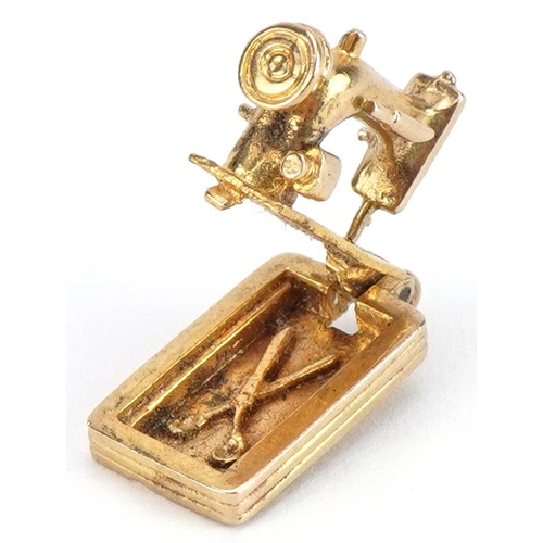 2104 - 9ct gold opening sewing machine charm, 1.9cm in length, 3.8g