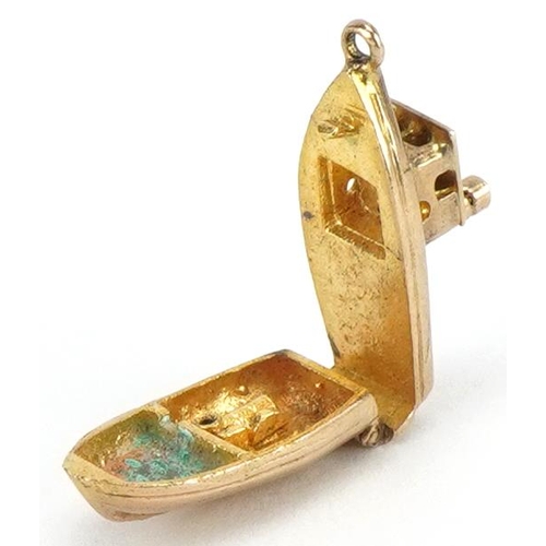 2082 - 9ct gold opening fishing boat charm, 2.2cm in length, 3.7g