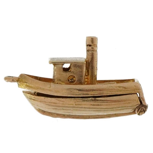 2082 - 9ct gold opening fishing boat charm, 2.2cm in length, 3.7g