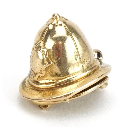 2077 - 9ct gold opening policeman's helmet charm, 1.4cm high, 4.3g