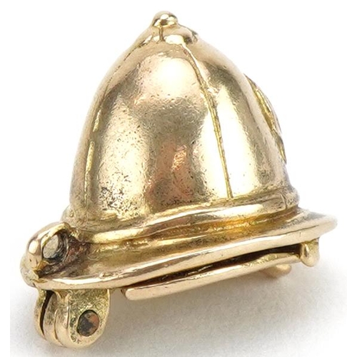 2077 - 9ct gold opening policeman's helmet charm, 1.4cm high, 4.3g