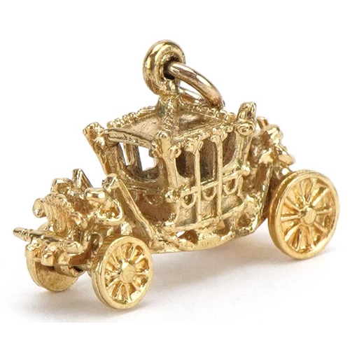 2096 - 9ct gold coronation coach charm, 2.1cm in length, 3.1g