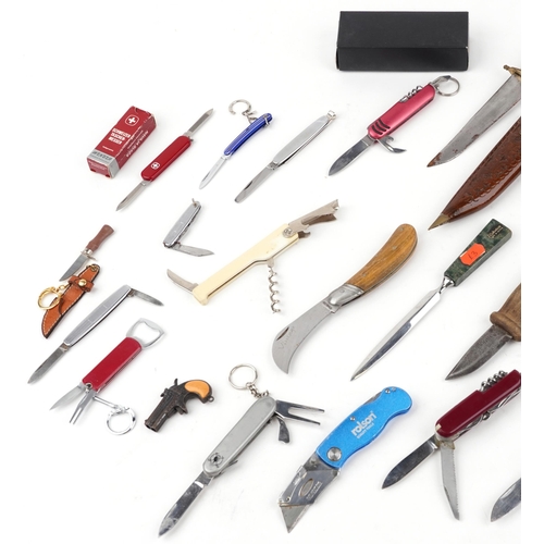 1803 - Vintage and later knives, folding pocket tools and a set of num-chuks including Swiss Army and Norwe... 