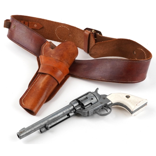 717 - Decorative model of an Inert Colt Peacemaker revolver with leather holster, the revolver 31cm in len... 