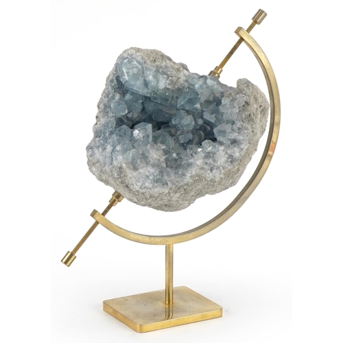 259 - Geology interest natural history celesit specimen mounted on brass globe type stand, 19cm high