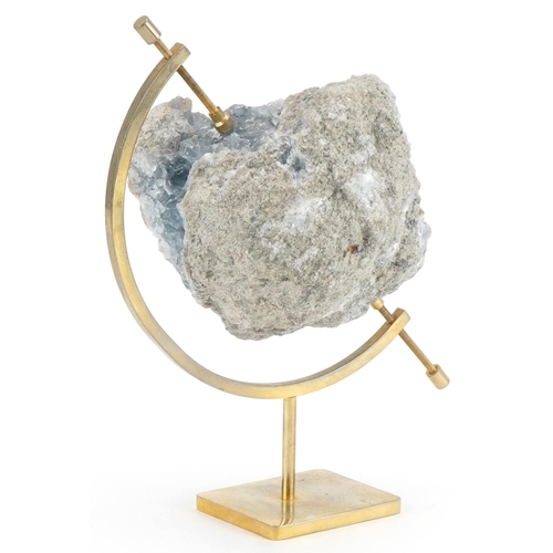 259 - Geology interest natural history celesit specimen mounted on brass globe type stand, 19cm high