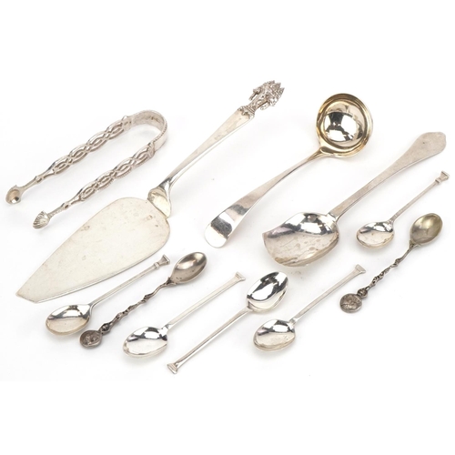 435 - Antique and later silver cutlery including a Thai cake slice, sugar tongs and ladle, the largest 23c... 