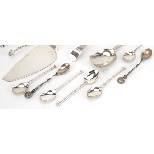 435 - Antique and later silver cutlery including a Thai cake slice, sugar tongs and ladle, the largest 23c... 