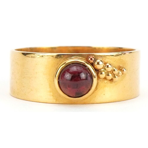 502 - Stylish 22ct gold ring set with a cabochon garnet, RDS maker's mark, size M, 4.8g