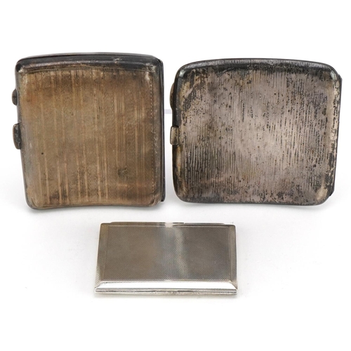 99 - Two Edwardian and later silver cigarette cases and an engine turned silver compact, the largest 8.5c... 