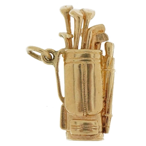 2112 - 9ct gold golf caddy and clubs charm, 2.5cm high, 3.9g