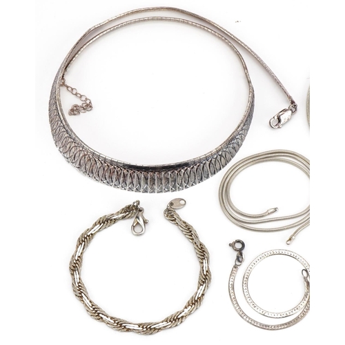 2591 - Collection of silver flat link necklaces, bracelets and pair of earrings, the largest 45cm in length... 