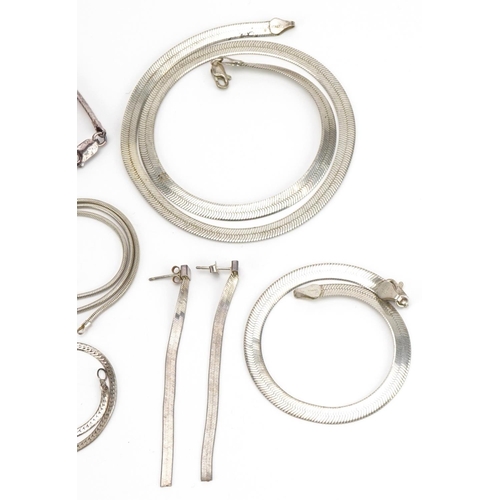 2591 - Collection of silver flat link necklaces, bracelets and pair of earrings, the largest 45cm in length... 