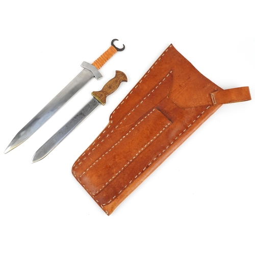 719 - Two re-enactment Celtic or Viking style short swords with leather sheath, the largest sword 59cm in ... 