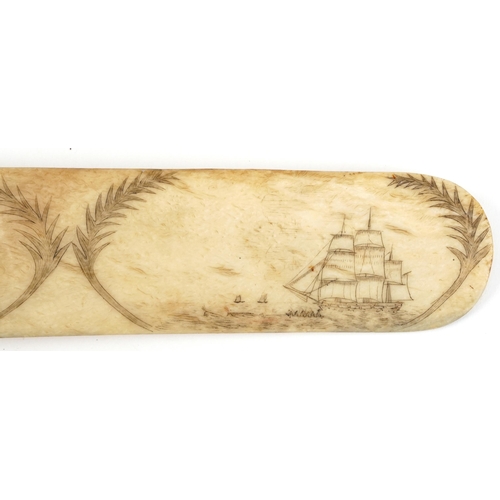 180 - Antique sailor's scrimshaw whale bone page turner carved with figures and rigged ship, 36cm wide