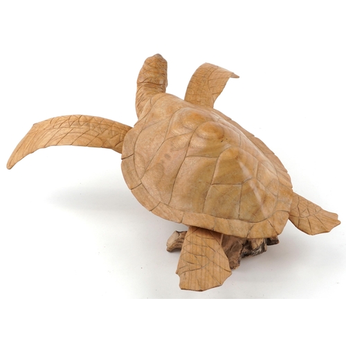 1580 - Large carved wood carving of a sea turtle raised on a naturalistic stand, 58cm in length