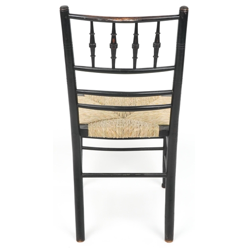 1089 - Attributed to Philip Webb for Morris & Co, Arts & Crafts ebonised Sussex chair retailed by Liberty o... 