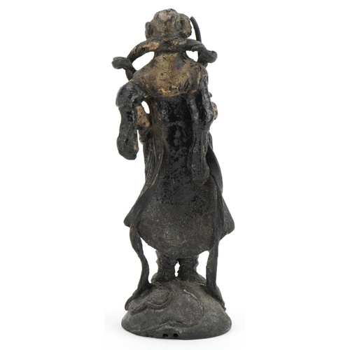 1492 - Chinese lacquered cast metal figure of a warrior with remnants of gilding and paint, 20cm high