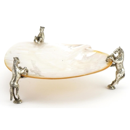 1478 - Mother of pearl dish raised on three silver plated mounts in the form of rearing horses, 19cm wide