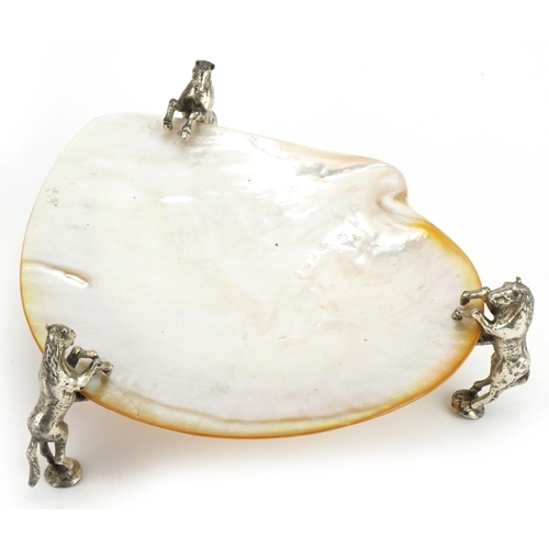 1478 - Mother of pearl dish raised on three silver plated mounts in the form of rearing horses, 19cm wide