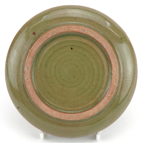 1519 - Korean porcelain bun box and cover having a celadon glaze, incised with flowers, 13cm in diameter