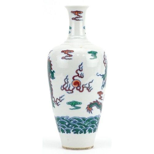 1707 - Chinese wucai porcelain vase hand painted with dragons chasing the flaming pearl amongst clouds, six... 