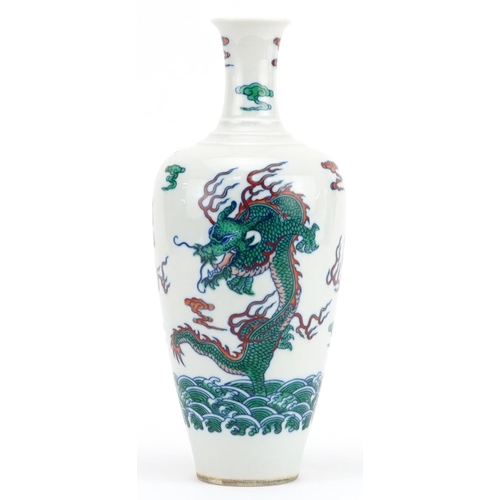 1707 - Chinese wucai porcelain vase hand painted with dragons chasing the flaming pearl amongst clouds, six... 