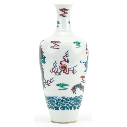 1707 - Chinese wucai porcelain vase hand painted with dragons chasing the flaming pearl amongst clouds, six... 