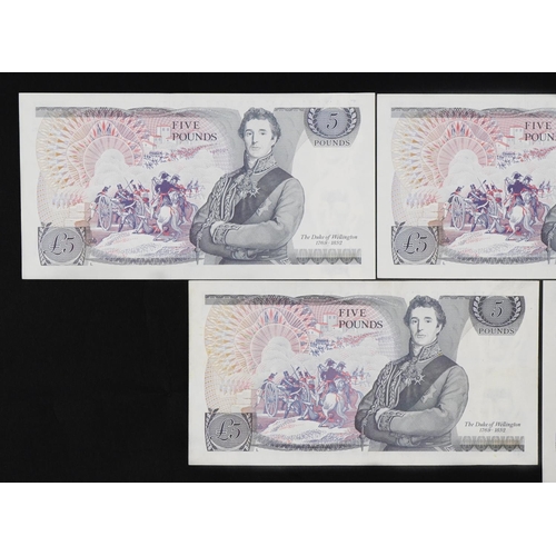 860 - Five Elizabeth II Bank of England five pound banknotes, three with consecutive serial numbers compri... 