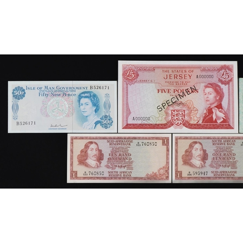 876 - Banknotes including States of Jersey five pound specimen note and States of Guernsey one pound