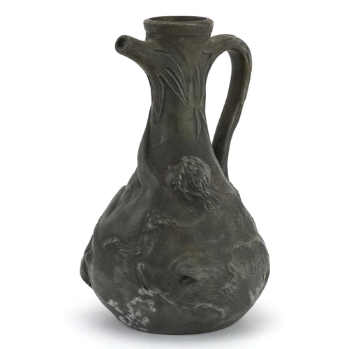 421 - Jean Garnier, French Art Nouveau pewter jug decorated in relief with a nude female and two mythical ... 