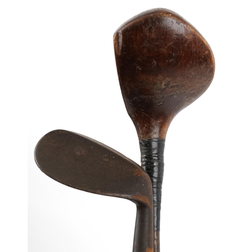 1290 - Predominantly vintage wooden shafted golf clubs housed in a vintage caddy including Cargills Ltd, Jo... 