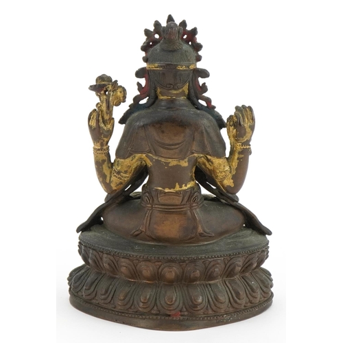 16 - 18th Century Chino Tibetan gilt bronze buddha of Sadaksari inset with turquoise cabochons, 16cm high... 