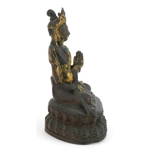 16 - 18th Century Chino Tibetan gilt bronze buddha of Sadaksari inset with turquoise cabochons, 16cm high... 