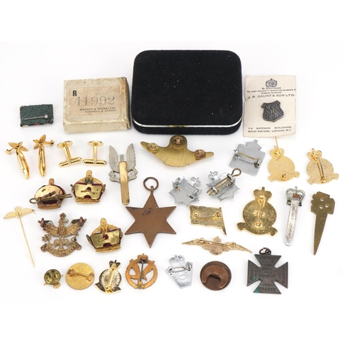 583 - British militaria including World War II Italy star, RAF cufflinks, cap badges and pin badges