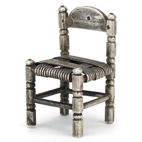 355 - Miniature Egyptian silver doll's house chair, 4.5cm high, 25.4g