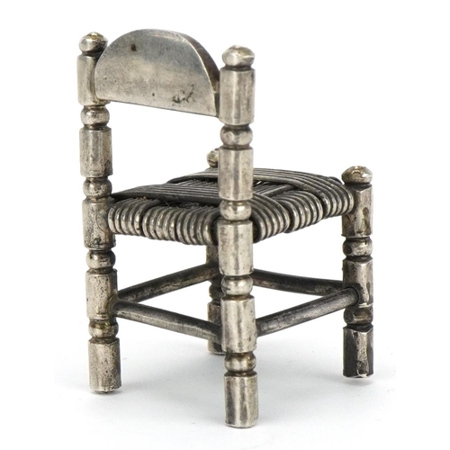 355 - Miniature Egyptian silver doll's house chair, 4.5cm high, 25.4g